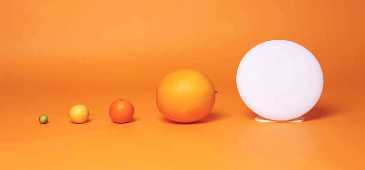 The lamp beside a lime, a lemon, an orange, and a grapefruit, to scale.