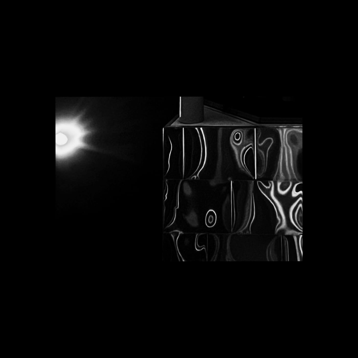 A bright flare beside a rippled, distorted panel.