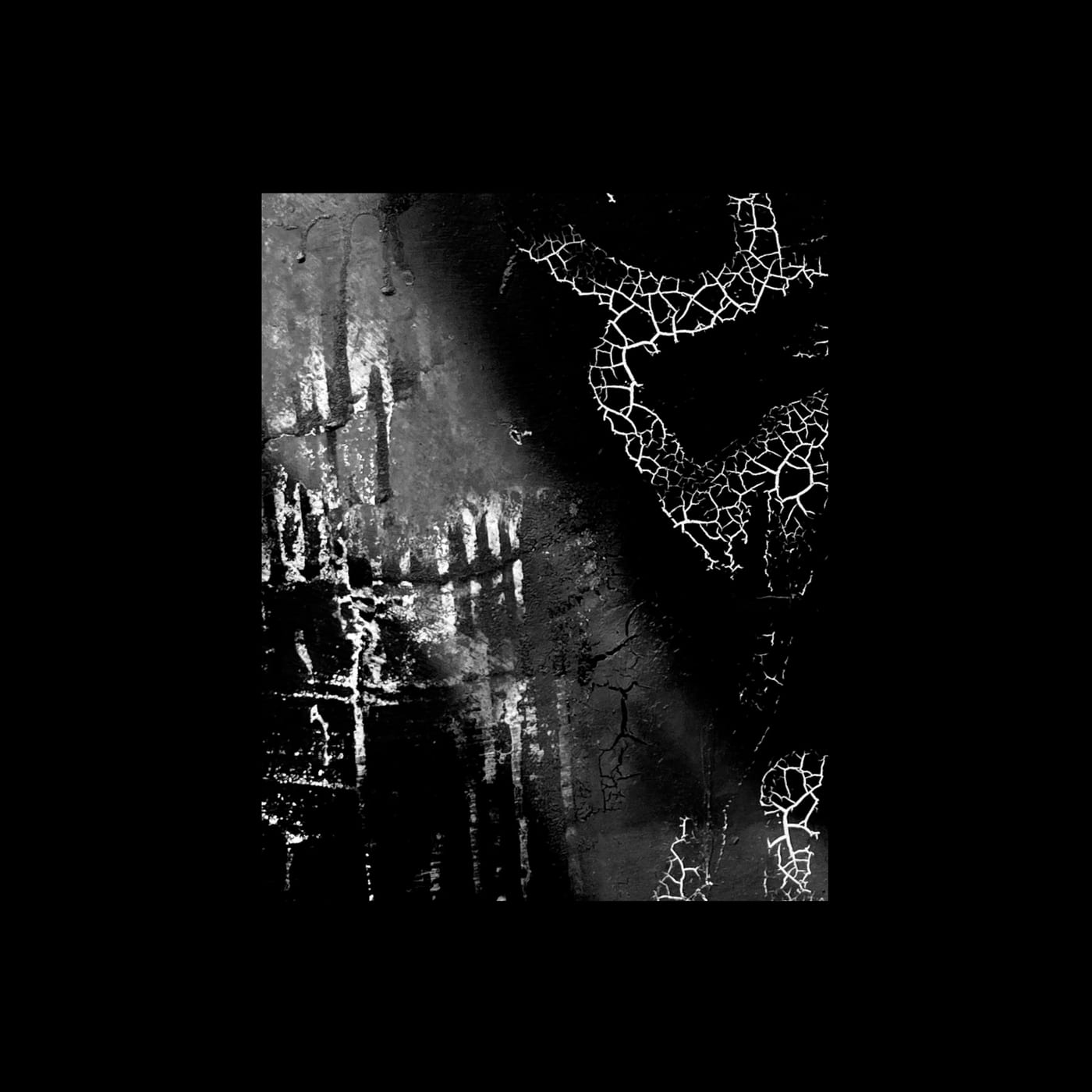 Bright cracks running through a dark raised surface.