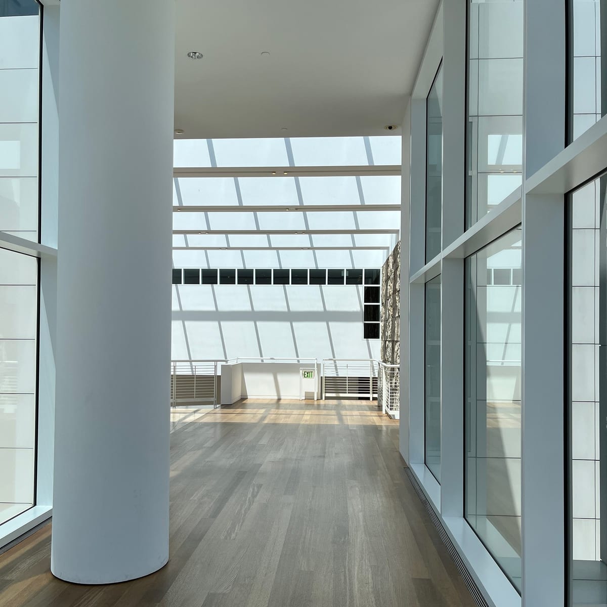 The original photograph: a glazed corridor with a white window grid.